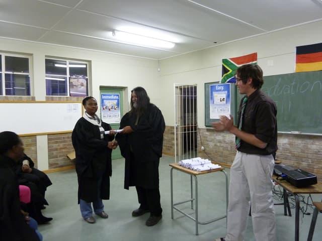 Alex at graduation ceremony for evening computer classes